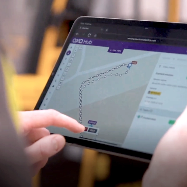 Oxa-Hub Oxa Hub interface shown on a tablet, mapping a planned route.