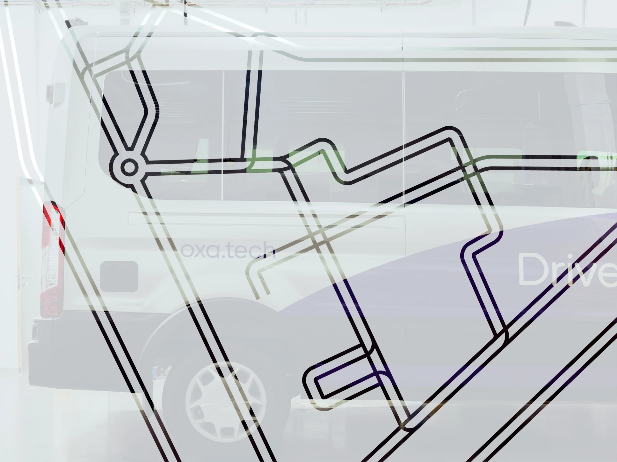 Oxa-branded Ford Transit in the Culham workshop	seen through frosted glass with a cut-out test track map.